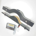 Schwarze Holzknebel und elektrisierender BDSM E-Stim Hodenquetscher